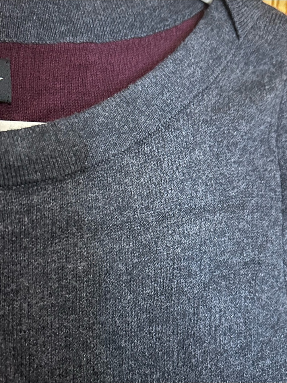 Women's Crewneck Sweater in Charcoal Heather with maroon accents at the sleeves